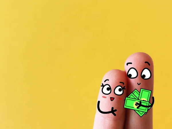 两根手指被装饰成一对甜蜜的夫妇 他们有些钱 — 图库照片