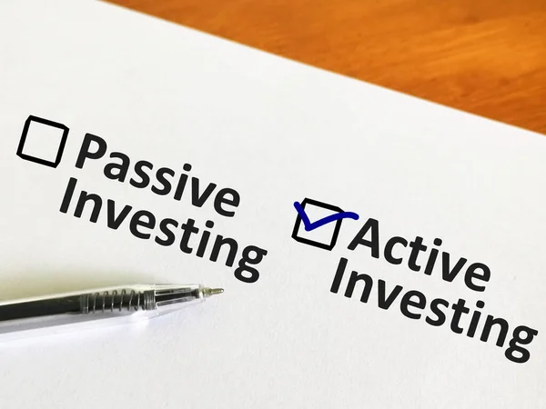 One person is answering question about investment. The person is thinking to do active or passive investment. The person chooses active investing.