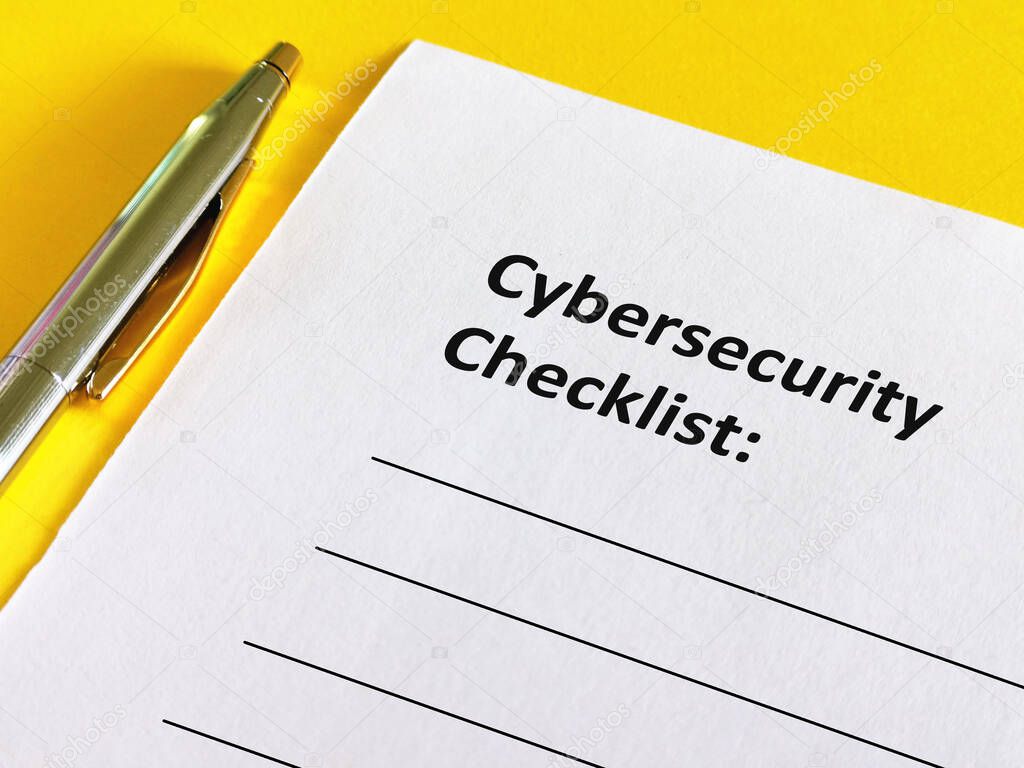 One person is answering question. He is writing cybersecurity checklist.