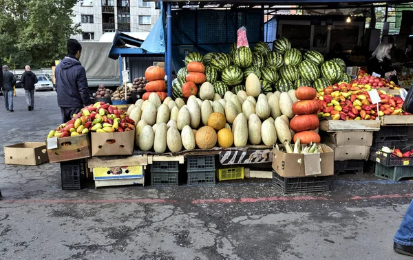 watermelons and melons, pumpkins and peppers on the mini market on the street, autumn, Sunny, warm