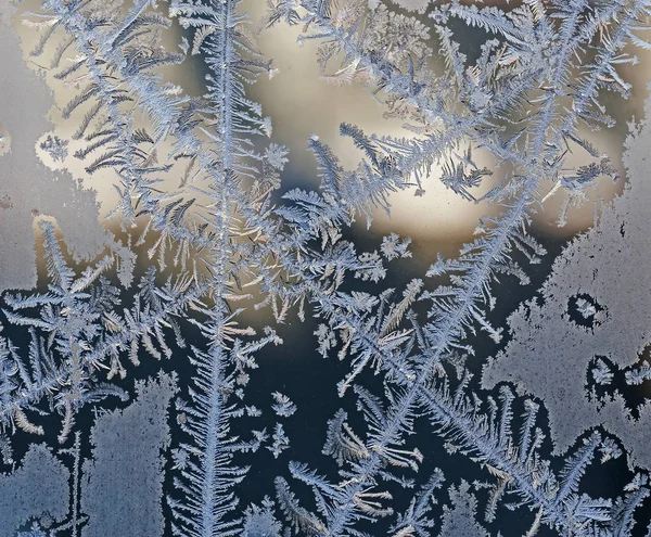 Intersecting to frost line, patterns on the window glass — Stock Photo, Image