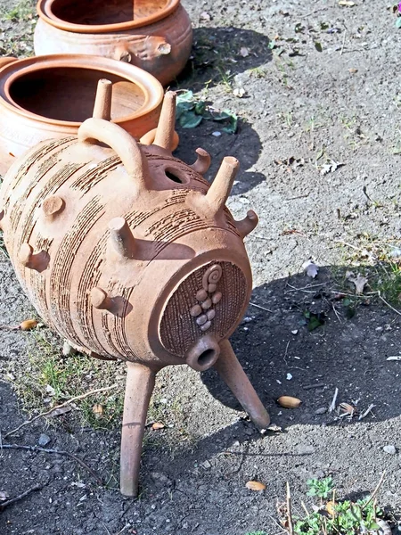 old clay broken pottery on the ground in the yard of a roadside restaurant