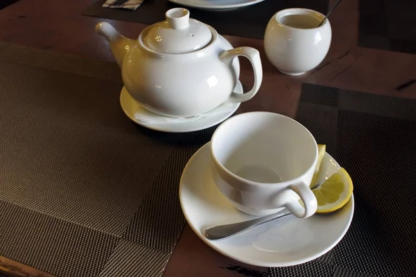 Drinking morning tea, tea dishes on the table — Stock Photo, Image