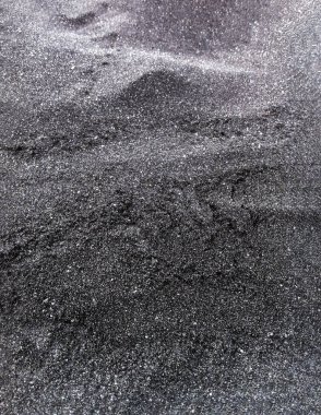 Volkanik kumdan yapılmış güzel bir gri arka plan. Koyu doku