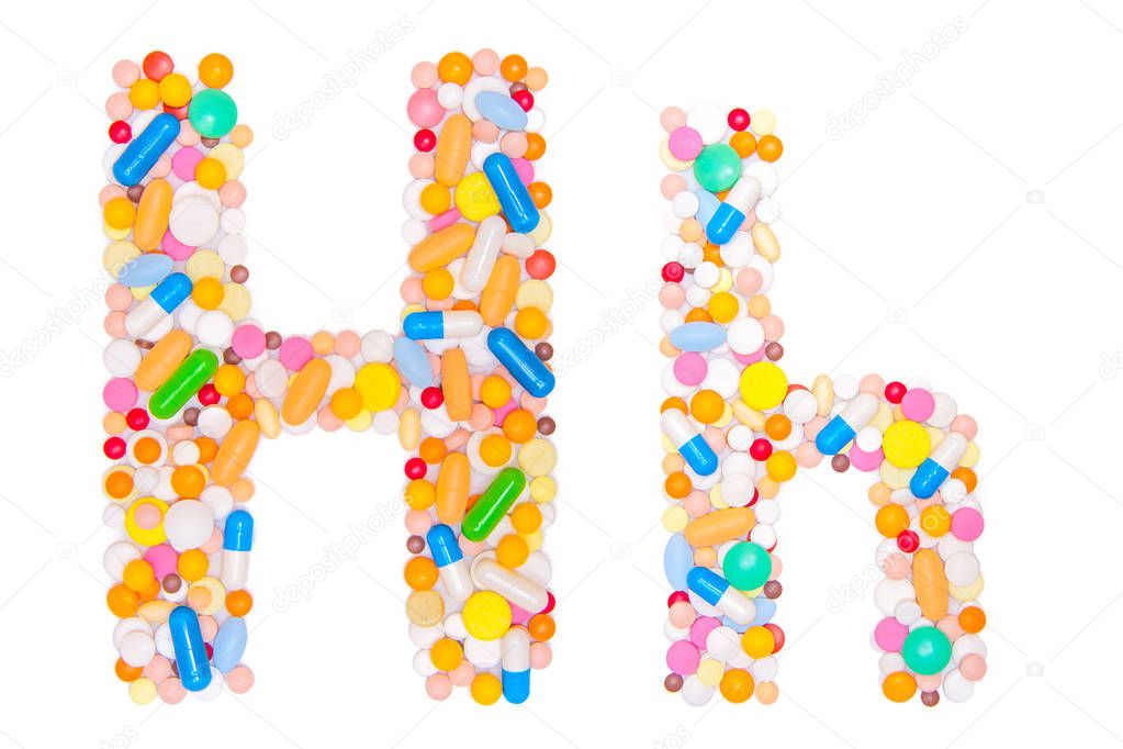 Letter H, English alphabet, made, collected from medical tablets, pills, capsules, vitamin. Isolated on white background. Concept: ABC, design, logo, title, text, word