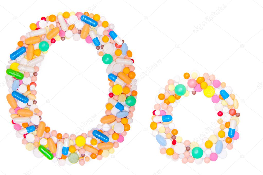 Letter O, English alphabet, made, collected from medical tablets, pills, capsules, vitamin. Isolated on white background. Concept: ABC, design, logo, title, text, word