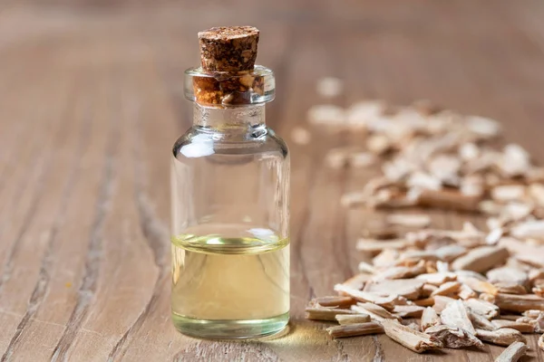 Bottle Essential Oil Cedar Wood Chips Table — Stock Photo, Image