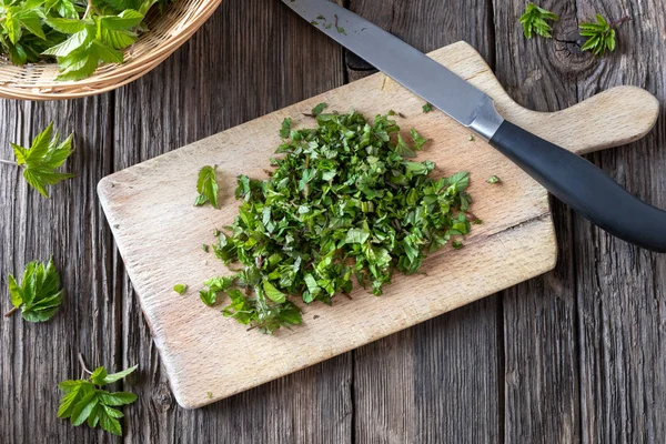 Cut-up ground elder leaves on a cutting board