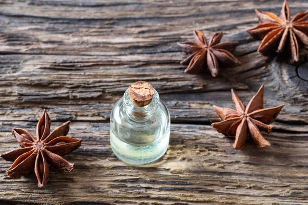 A bottle of star anise essential oil with star anise