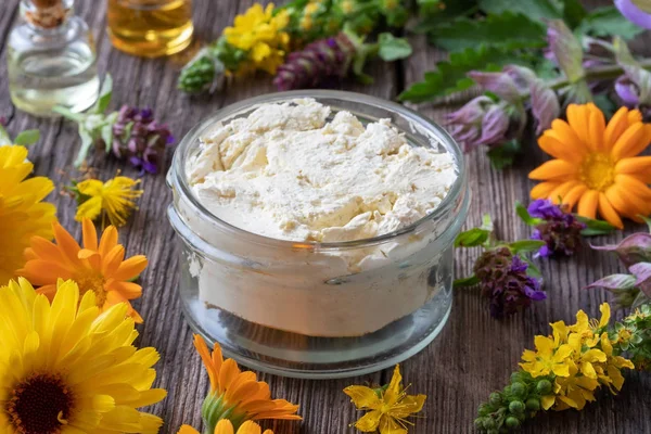 Homemade cream from herbs, essential oils and shea butter