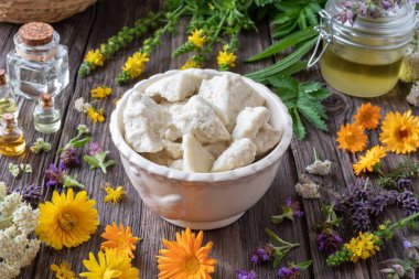 Shea butter, essential oils and medicinal herbs clipart