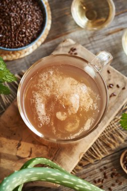 Homemade flax seed gel, aloe vera leaf, apple cider vinegar and nettle - ingredients for natural diy shampoo. Alternative haircare, no poo.     