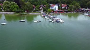 Ammersee Bavaria Germany 15 June 2025 yachts at pier and waterfront houses Editorial use only