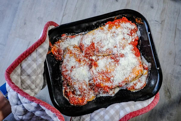Uncooked Dish Aubrgine Parmigiana Being Held Oven Glove Ready Slip — Stock Photo, Image