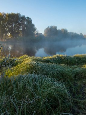 beautiful landscape in morning sunrise with a river