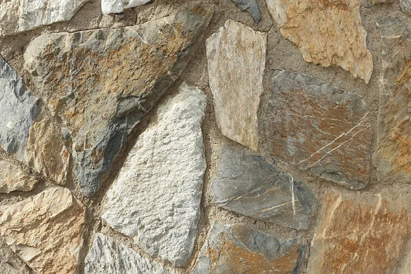 Una pared de piedra de piedra en bruto. Textura de piedra. Pared de piedra . — Foto de Stock