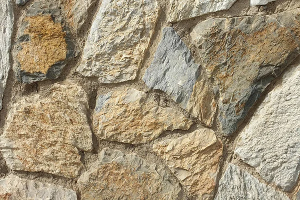 Una pared de piedra de piedra en bruto. Textura de piedra. Pared de piedra . — Foto de Stock