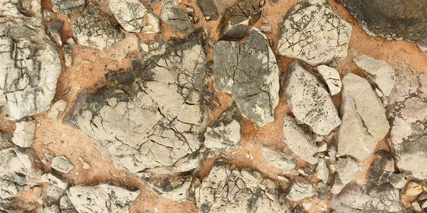 Steen. Textuur van kleurrijke mediterrane steen aan de kust — Stockfoto