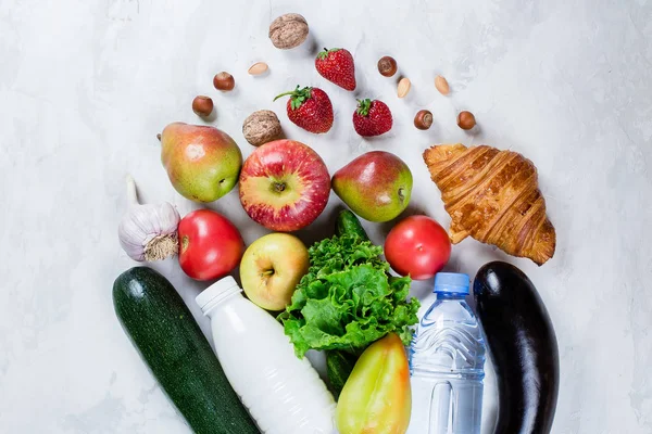 Food Background. Healthy food fruits, vegetables, bottles with water and milk on a white table. Top view. Flat lay. Copy Space — Stock Image Food Background Healthy Food Fruits Vegetables Bottles Water Milk White Stock Image