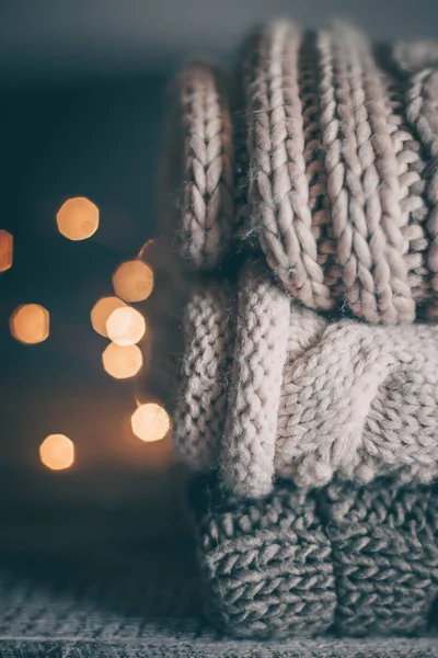 Stack Cozy Knitted Sweaters Garland Lights Wooden Background — Stock Photo, Image