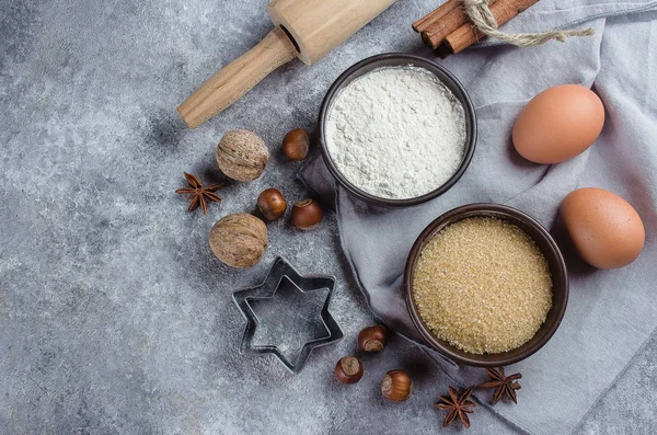 Baking ingredients for pastry on gray stone background