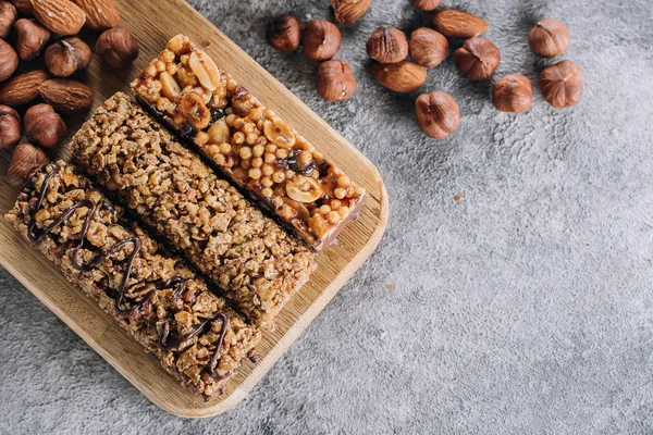 Health Bars and Mixed Nuts. Energy bars with almond and hazelnuts. Snack for healthy still life