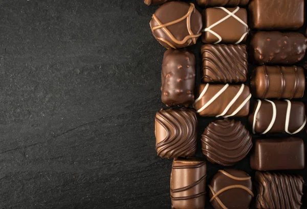 Beautiful Creative Chocolate Sweets Natural Black Stone Background Mix Chocolates — Stock Photo, Image