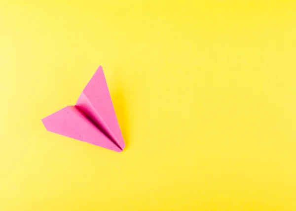 Pink Paper Plane Paper Airplane Origami Yellow Background Top View — Stock Photo, Image