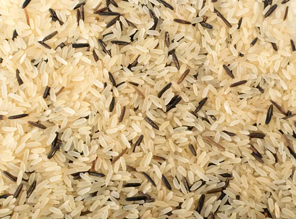Mix of Raw Black Wild Rice and Parboiled White Rice Top View. Background or Pattern with Healthy Dietetic Canada Rice