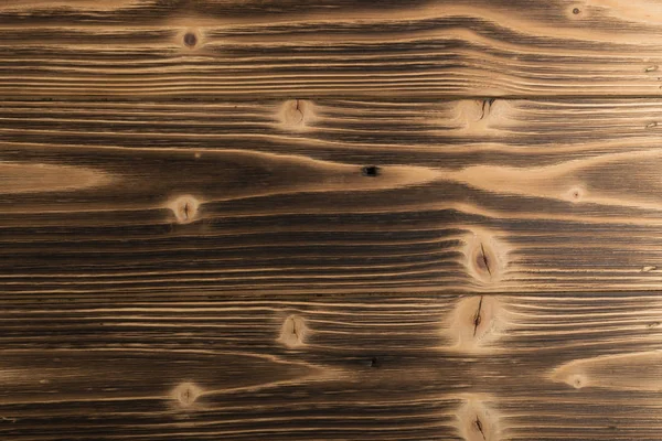 Eski karanlık ahşap arka plan yanmış. Ahşap tahta tahta doku vurulmuş. Vintage yenilikçi tasarım için doğal rustik fotoğraf zemin