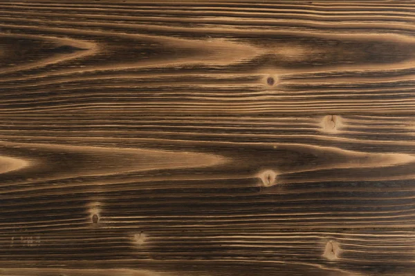 Eski karanlık ahşap arka plan yanmış. Ahşap tahta tahta doku vurulmuş. Vintage yenilikçi tasarım için doğal rustik fotoğraf zemin