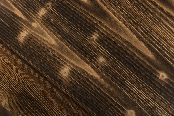 Eski karanlık ahşap arka plan yanmış. Ahşap tahta tahta doku vurulmuş. Vintage yenilikçi tasarım için doğal rustik fotoğraf zemin