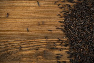 Ham siyah yabani pirinç arka plan üstten görünüm. Sağlıklı diyet Kanada Bio pirinç tahıl doku ile metin için yer