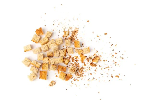 Scattered homemade bread croutons with crumbs isolated on white background top view. Crispy bread cubes, dry crumbs, rusks, crouoton or white roasted crackers cube heap — Stock Image Scattered Homemade Bread Croutons Crumbs Isolated White Background Top View Stock Image