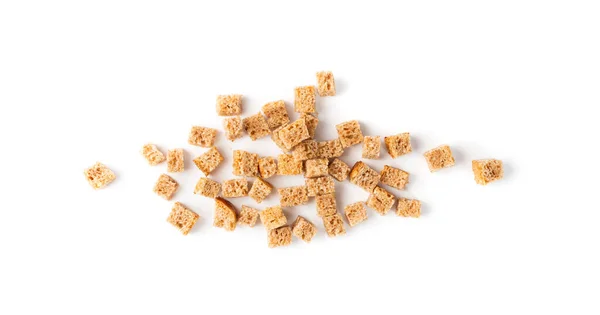Scattered pile of homemade rye bread croutons isolated on white background top view. Crispy bread cubes, dry rye crumbs, rusks, crouoton or brown roasted crackers cube heap — Stock Image Scattered Pile Homemade Rye Bread Croutons Isolated White Background Top Royalty Free Stock Photos