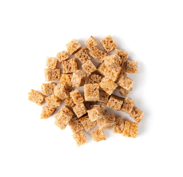 Pile of homemade rye bread croutons isolated on white background top view. Crispy bread cubes, dry rye crumbs, rusks, crouoton or brown roasted crackers cube heap — Stock Image Pile Homemade Rye Bread Croutons Isolated White Background Top View Stock Image