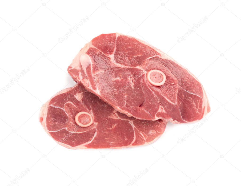 Raw lamb chops or mutton cuts isolated on white background. Fresh sheep meat cutlet on bone cut out top view