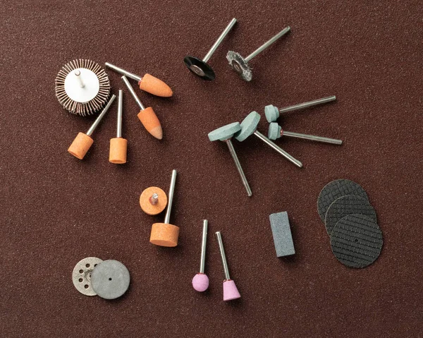 Polishing tools set for sander tool. Mini drill accessories with grinding polishing wheels, abrasive discs, sandpapers, sander tool collection, emery paper, small abrasive equipment — Stock Image Polishing Tools Set Sander Tool Mini Drill Accessories Grinding Polishing Stock Photo