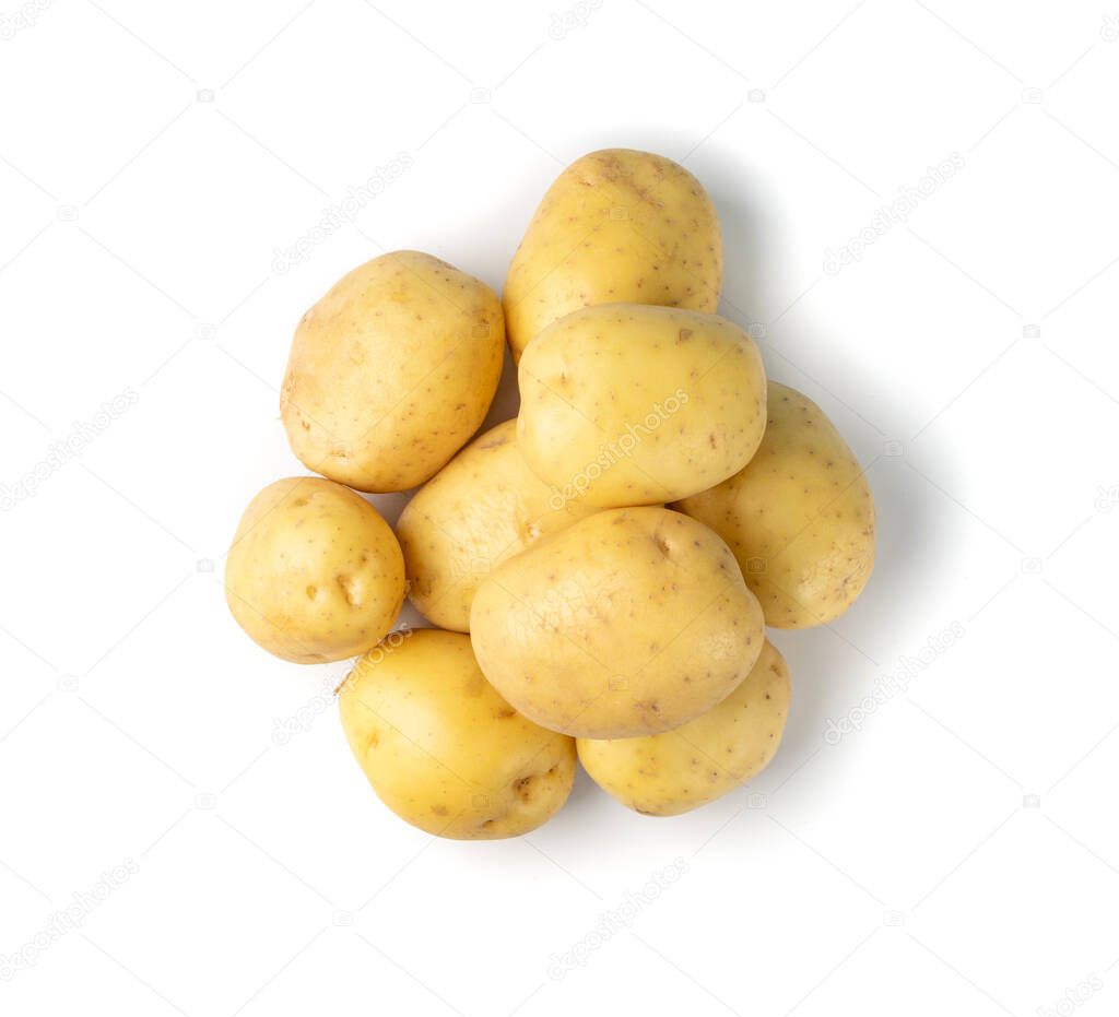 Raw whole potato pile isolated on white background top view. Yellow washed bio potatoes