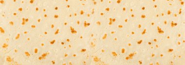 Krep dokusu arka planı. Pan kek deseni, soyut krep üst görünümü, hamur keki desenli arka plan, kızarmış ekmek afişi.