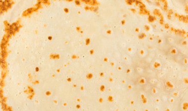 Krep dokusu arka planı. Pan kek deseni, soyut krep üst görünümü, hamur keki desenli arka plan, kızarmış ekmek afişi.