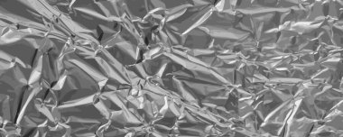 Alüminyum folyo dokusu, buruşmuş alüminyum kağıt desen, buruşuk teneke malzeme afişi, desenli soyut folyo modeli, metin için yazı alanı ile alüminyum folyo arka planı