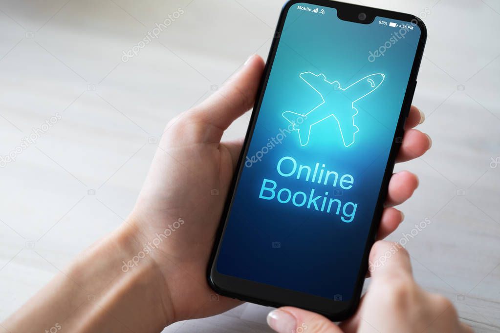 Flight booking application on mobile phone screen. Business and technology concept.