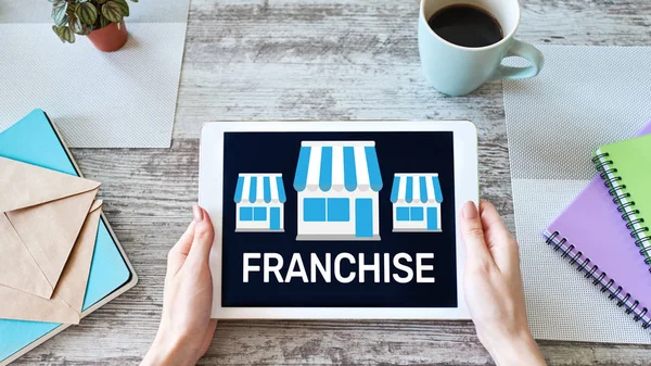 Franchise business model and growth concept on device screen.