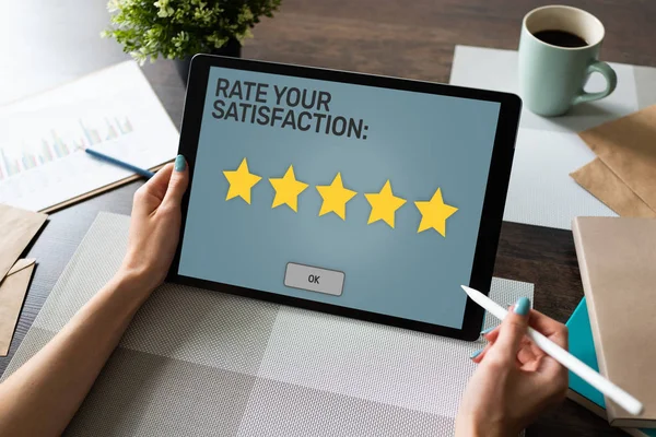 Rate your experience. Customer satisfaction review. Five star on device screen. Business Service quality control concept