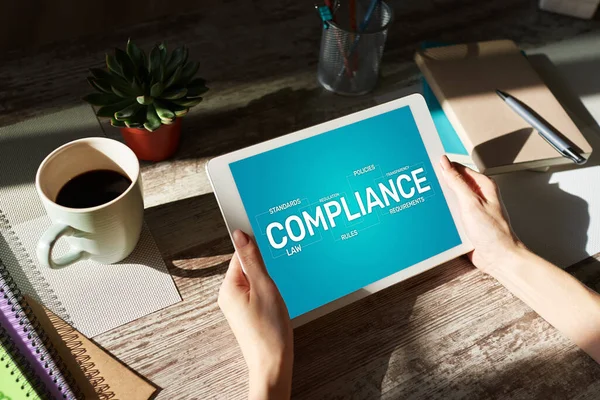 Compliance concept with icons and diagrams. Regulations, law, standards, requirements, audit. Concept on device screen. — Stock Photo, Image