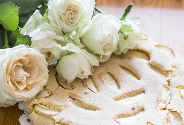 Bouquet of white roses and pie