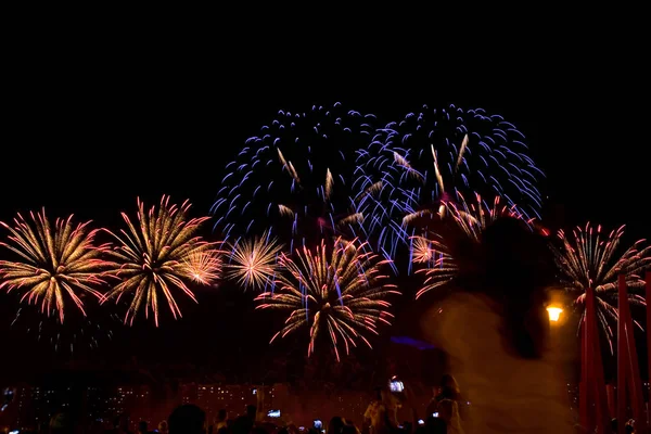 Viewers watch beautiful fireworks in the sky. Moscow.