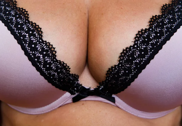 Bra and beautiful elastic natural female breasts close-up. — Stock Photo, Image