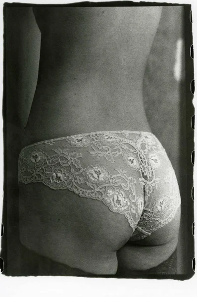 The back and buttocks of a slim woman in panties. — Stock Photo, Image